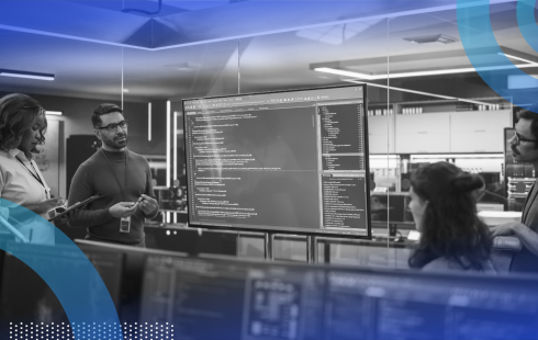 Technical writers working with product huddled around screen