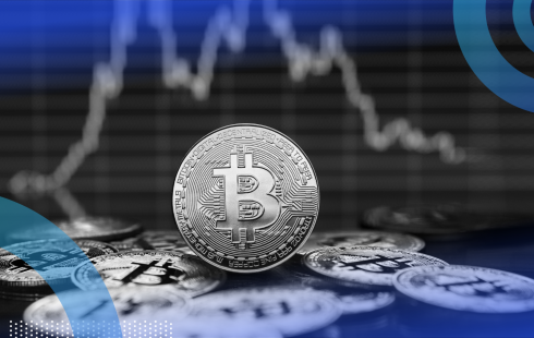 Crypto currency coin with stock market graph in background