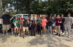 A group of Progress employees pose for a photo before spending their afternoon volunteering.
